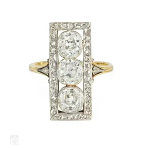 Antique three-stone diamond, platinum, and gold plaque ring