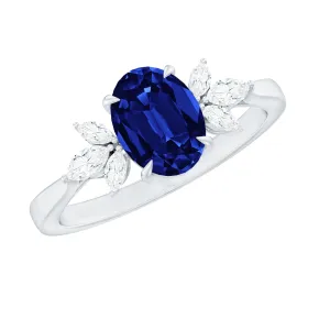 Oval Created Blue Sapphire Solitaire Ring with Diamond Trio