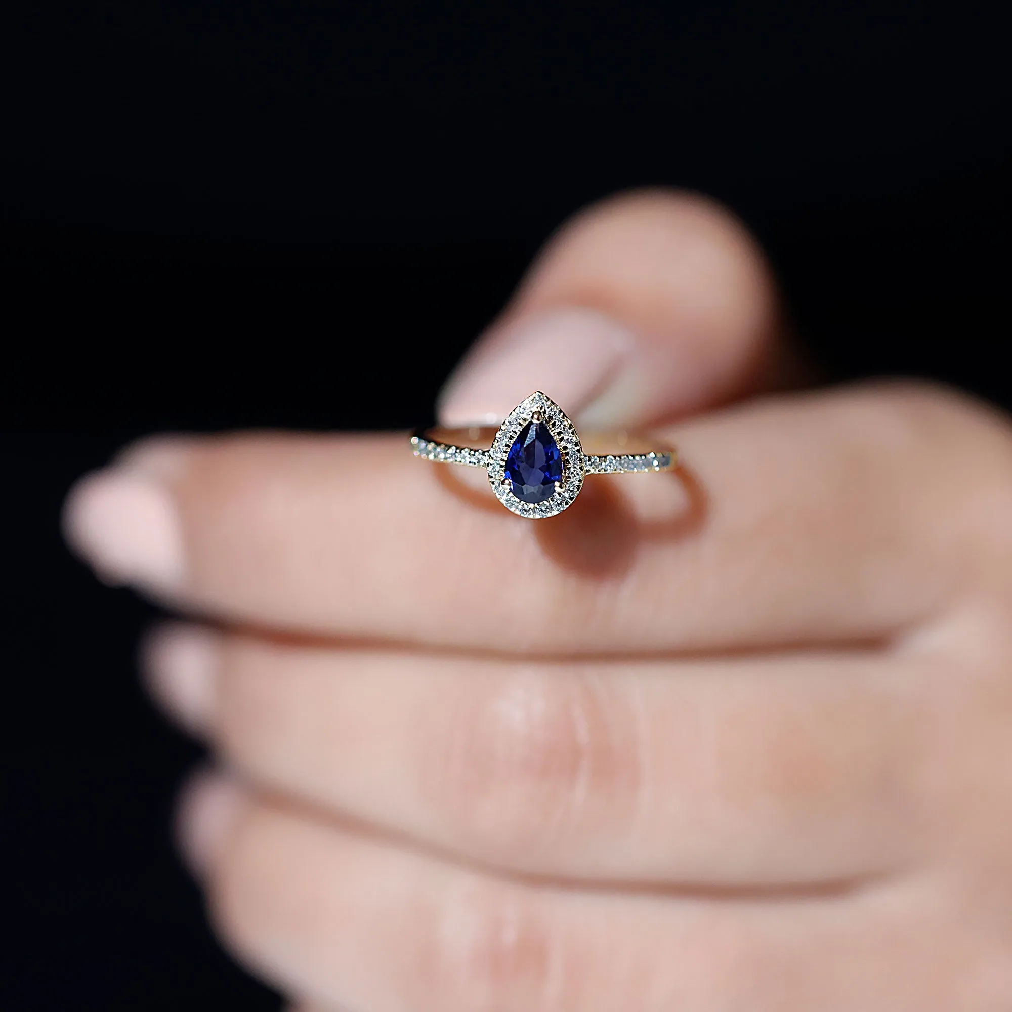 Pear Cut Created Blue Sapphire and Diamond Halo Ring