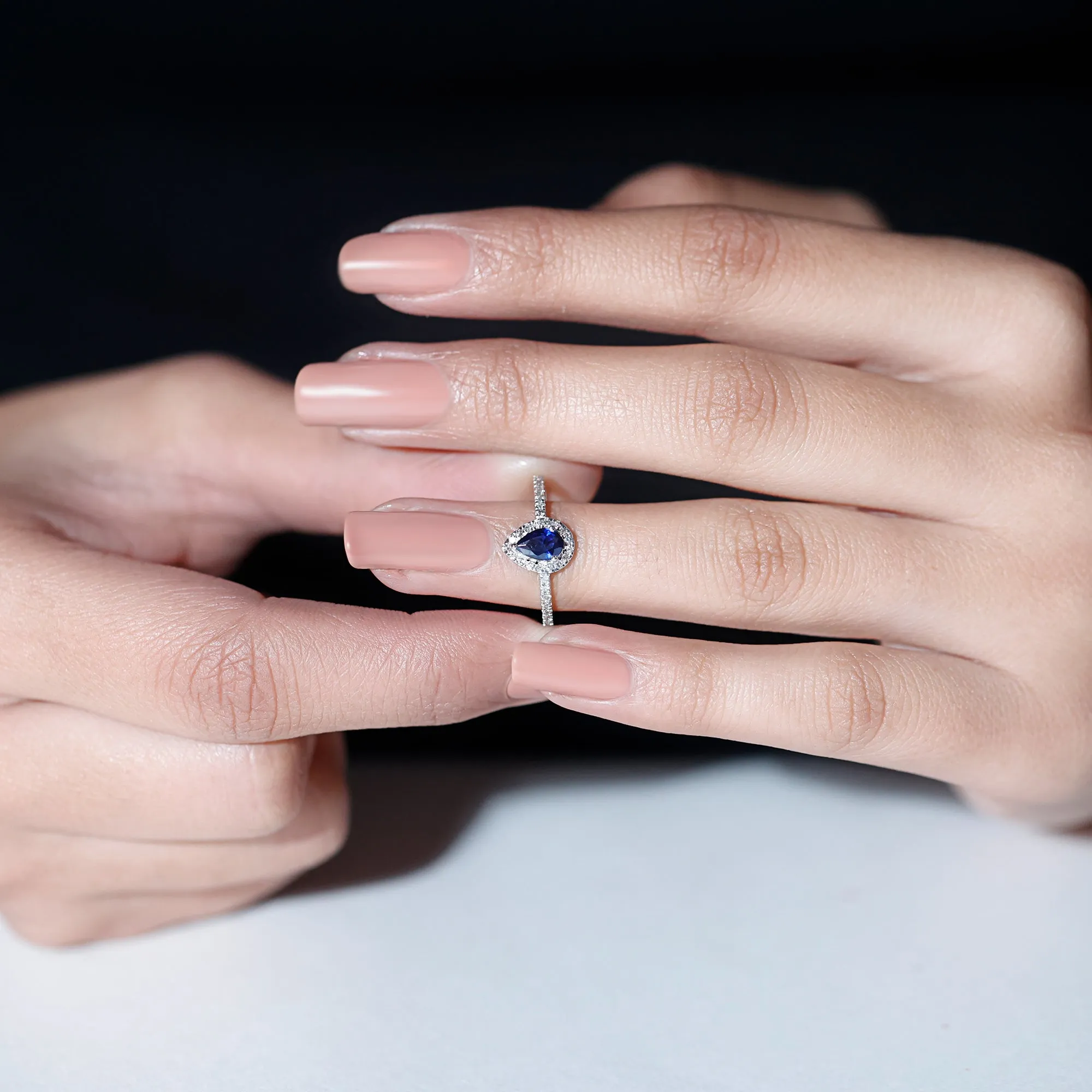 Pear Cut Created Blue Sapphire and Diamond Halo Ring