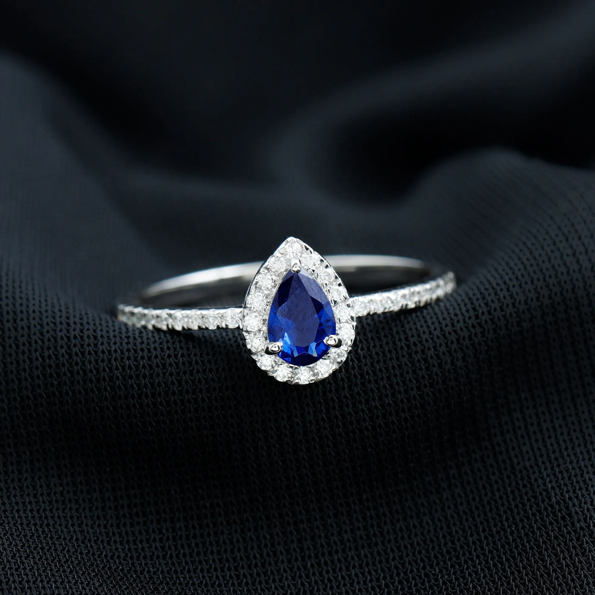 Pear Cut Created Blue Sapphire and Diamond Halo Ring