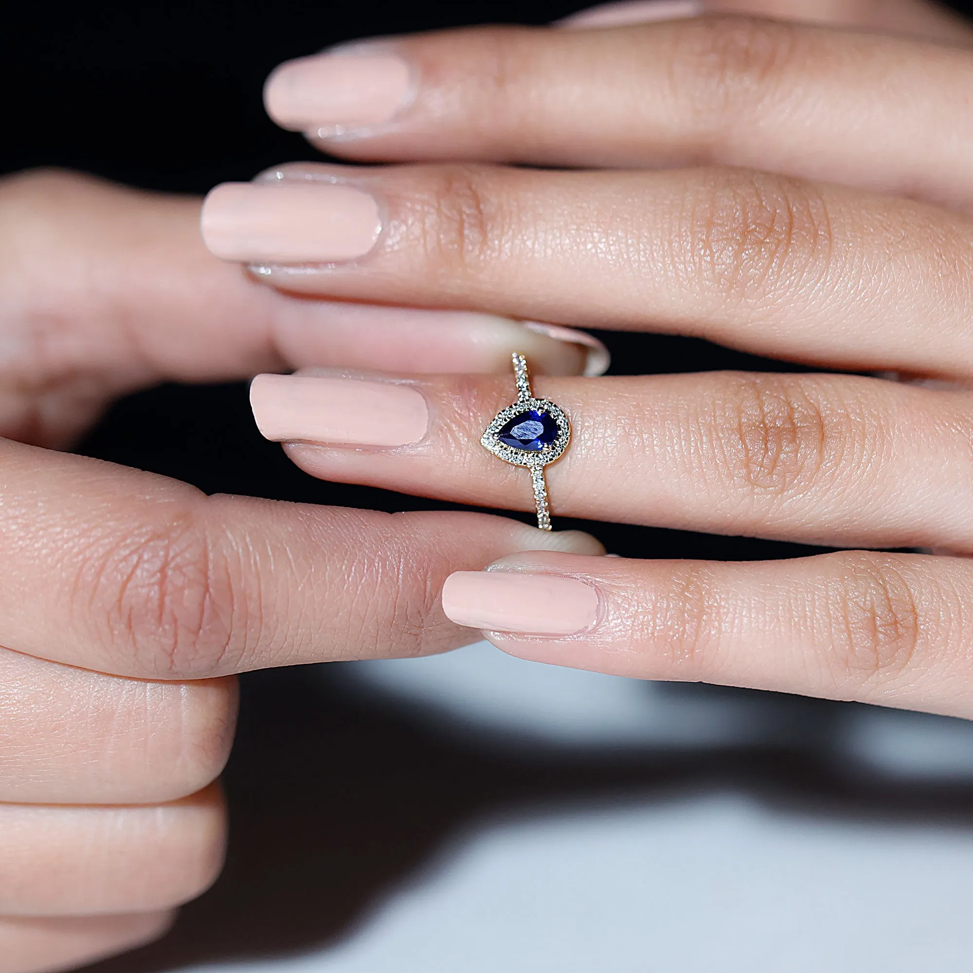 Pear Cut Created Blue Sapphire and Diamond Halo Ring