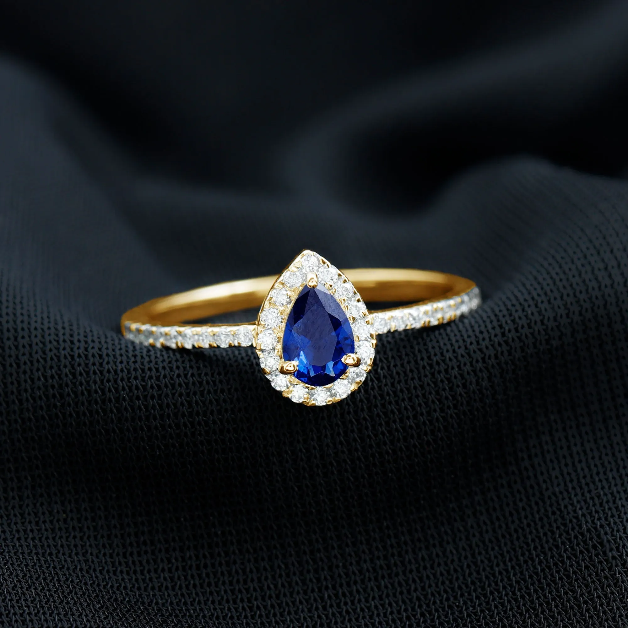 Pear Cut Created Blue Sapphire and Diamond Halo Ring